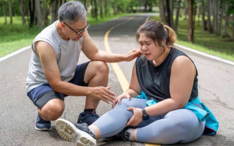 Woman With Injured Knee